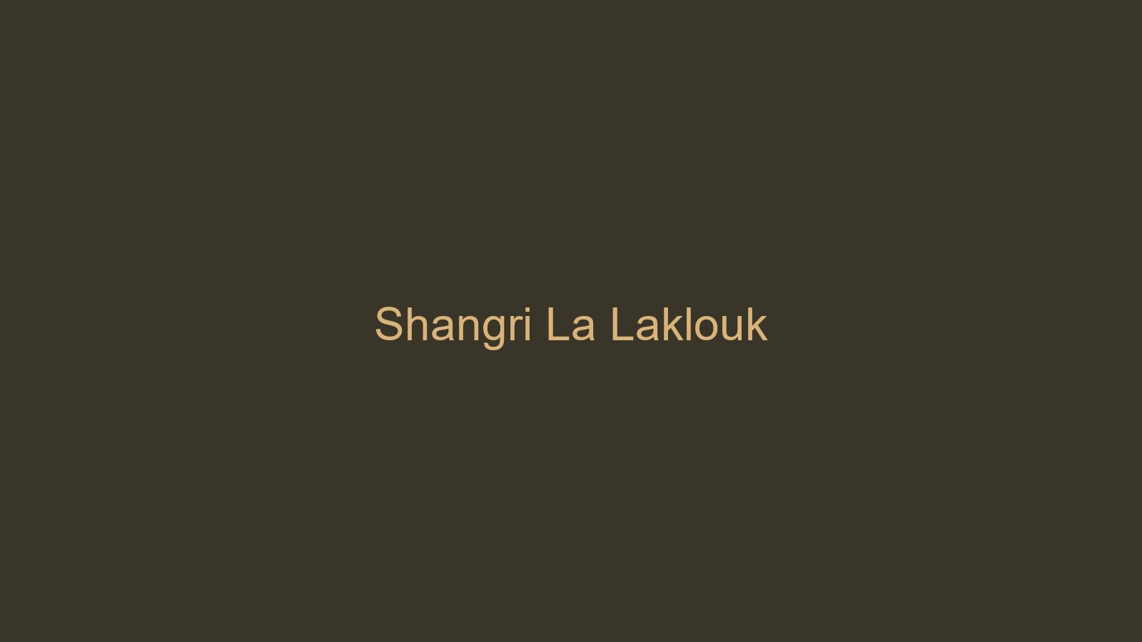 Shangri La Hotel Laklouk facade at dusk, warm limestone walls against cedar-pine forest edge